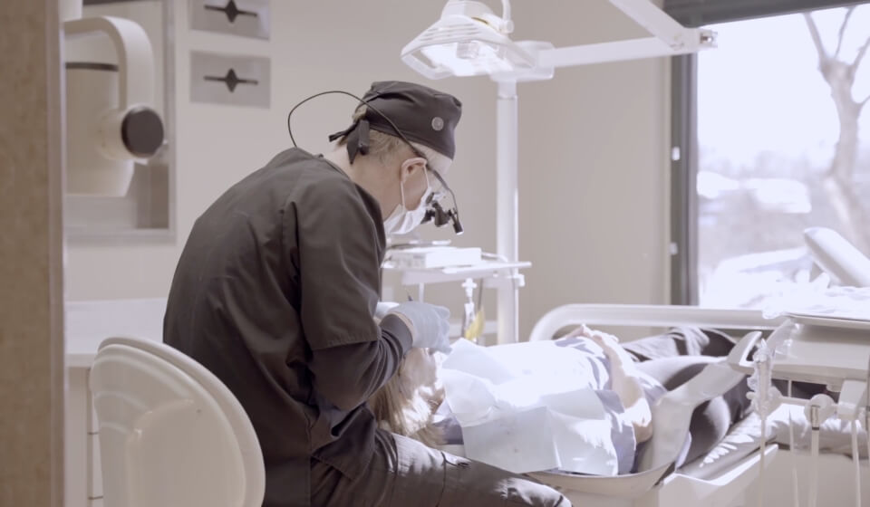 Sioux Falls dentist Dr. Edward Kusek performing a dental checkup on a patient